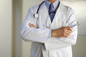 doctor standing with arms crossed