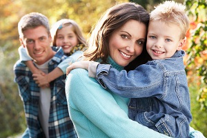 family smiling at camera